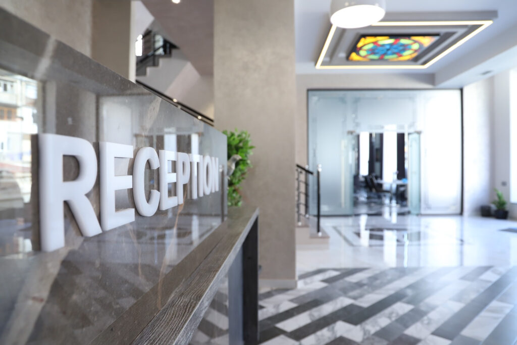 Reception desk and lobby of ThreeWays Hotel